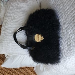 Black statement handbag by Michael Kors